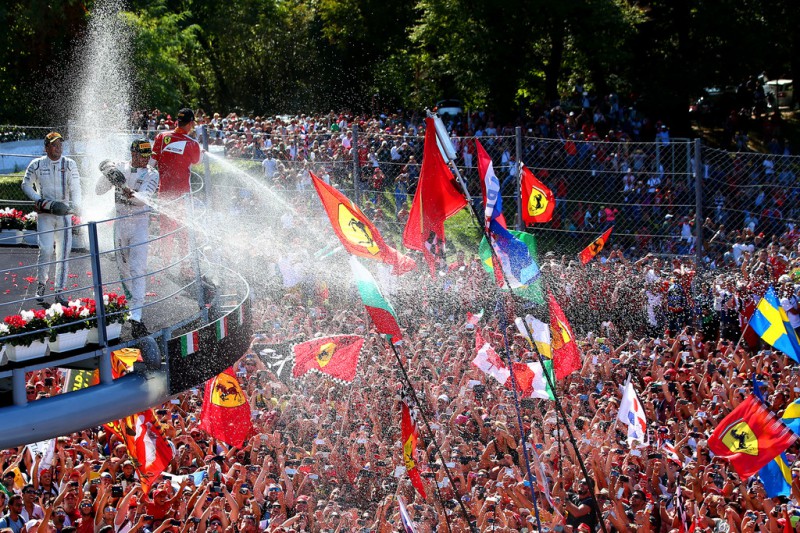 Lewis Hamilton of Great Britain and Mercedes GP celebrates on the podium next to Sebastian Vettel of Germany and Ferrari and Felipe Massa of Brazil and Williams after winning the Formula One Grand Prix of Italy at Autodromo di Monza on September 6, 2015 in Monza, Italy. Lewis Hamilton of Great Britain and Mercedes GP celebrates on the podium next to Sebastian Vettel of Germany and Ferrari and Felipe Massa of Brazil and Williams after winning the Formula One Grand Prix of Italy at Autodromo di Monza on September 6, 2015 in Monza, Italy.