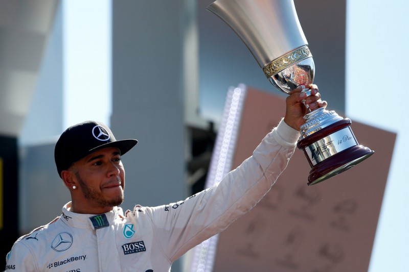 Lewis Hamilton of Great Britain and Mercedes GP lifts the trophy on the podium after winning the Formula One Grand Prix of Italy at Autodromo di Monza on September 6, 2015 in Monza, Italy. Lewis Hamilton of Great Britain and Mercedes GP lifts the trophy on the podium after winning the Formula One Grand Prix of Italy at Autodromo di Monza on September 6, 2015 in Monza, Italy.