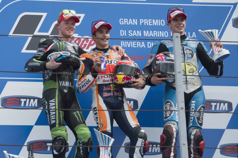 (L-R) Bradley Smith of Great Britain and Monster Yamaha Tech 3, Marc Marquez of Spain and Repsol Honda Team and Scott Redding of Great Britain and Estrella Galicia 0,0 Marc VDS celebrate on the podium at the end of the MotoGP World Championship race during the San Marino GP at Misano World Circuit on September 13, 2015 in Misano Adriatico, Italy. (L-R) Bradley Smith of Great Britain and Monster Yamaha Tech 3, Marc Marquez of Spain and Repsol Honda Team and Scott Redding of Great Britain and Estrella Galicia 0,0 Marc VDS celebrate on the podium at the end of the MotoGP World Championship race during the San Marino GP at Misano World Circuit on September 13, 2015 in Misano Adriatico, Italy.