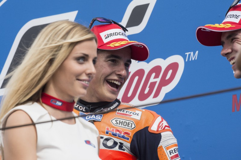 Marc Marquez of Spain and Repsol Honda Team celebrates the victory on the podium after the MotoGP World Championship race during the San Marino GP at Misano World Circuit on September 13, 2015 in Misano Adriatico, Italy. Marc Marquez of Spain and Repsol Honda Team celebrates the victory on the podium after the MotoGP World Championship race during the San Marino GP at Misano World Circuit on September 13, 2015 in Misano Adriatico, Italy.