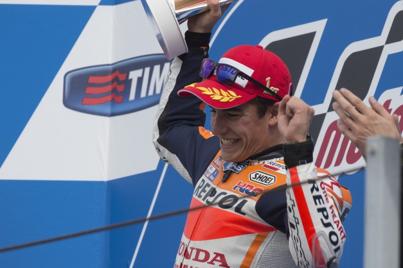 Marc Marquez of Spain and Repsol Honda Team celebrates the victory on the podium after the MotoGP World Championship race during the San Marino GP at Misano World Circuit on September 13, 2015 in Misano Adriatico, Italy. Marc Marquez of Spain and Repsol Honda Team celebrates the victory on the podium after the MotoGP World Championship race during the San Marino GP at Misano World Circuit on September 13, 2015 in Misano Adriatico, Italy.