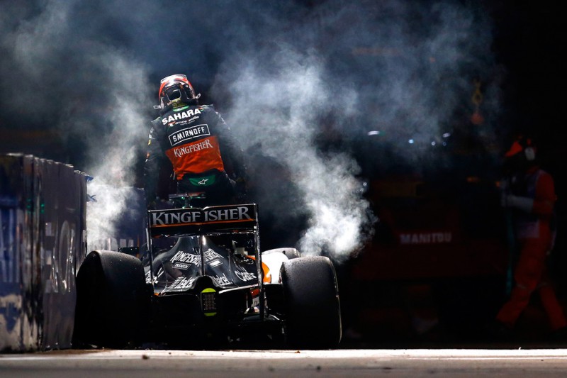 Nico Hulkenberg of Germany and Force India climbs out of his car after crashing during the Formula One Grand Prix of Singapore at Marina Bay Street Circuit on September 20, 2015 in Singapore. Nico Hulkenberg of Germany and Force India climbs out of his car after crashing during the Formula One Grand Prix of Singapore at Marina Bay Street Circuit on September 20, 2015 in Singapore.
