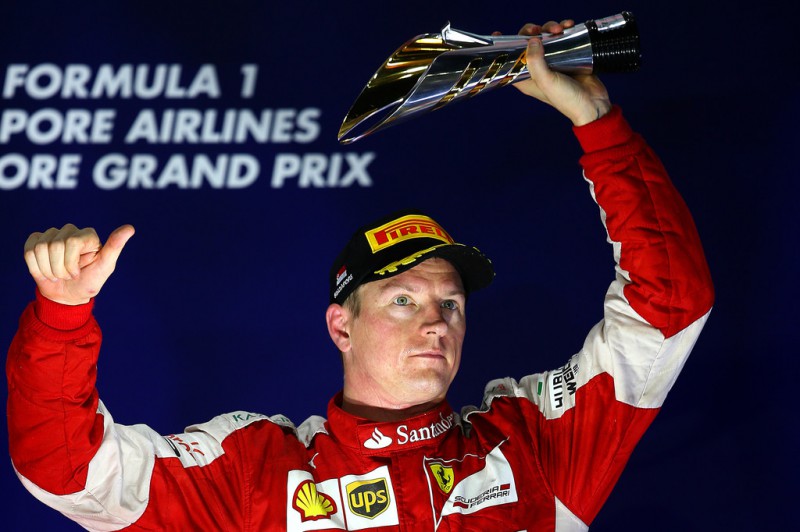 Kimi Raikkonen of Finland and Ferrari celebrates on the podium after finsihing third in the Formula One Grand Prix of Singapore at Marina Bay Street Circuit on September 20, 2015 in Singapore. Kimi Raikkonen of Finland and Ferrari celebrates on the podium after finsihing third in the Formula One Grand Prix of Singapore at Marina Bay Street Circuit on September 20, 2015 in Singapore.
