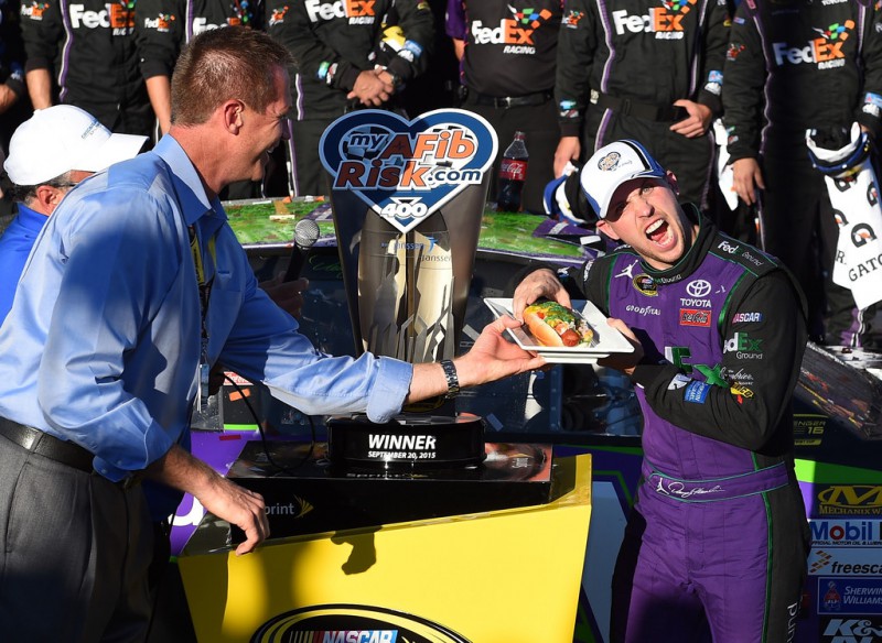 Denny Hamlin, driver of the #11 FedEx Ground Toyota, celebrates in Victory Lane after winning the NASCAR Sprint Cup Series myAFibRisk.com 400 at Chicagoland Speedway on September 20, 2015 in Joliet, Illinois. Denny Hamlin, driver of the #11 FedEx Ground Toyota, celebrates in Victory Lane after winning the NASCAR Sprint Cup Series myAFibRisk.com 400 at Chicagoland Speedway on September 20, 2015 in Joliet, Illinois.