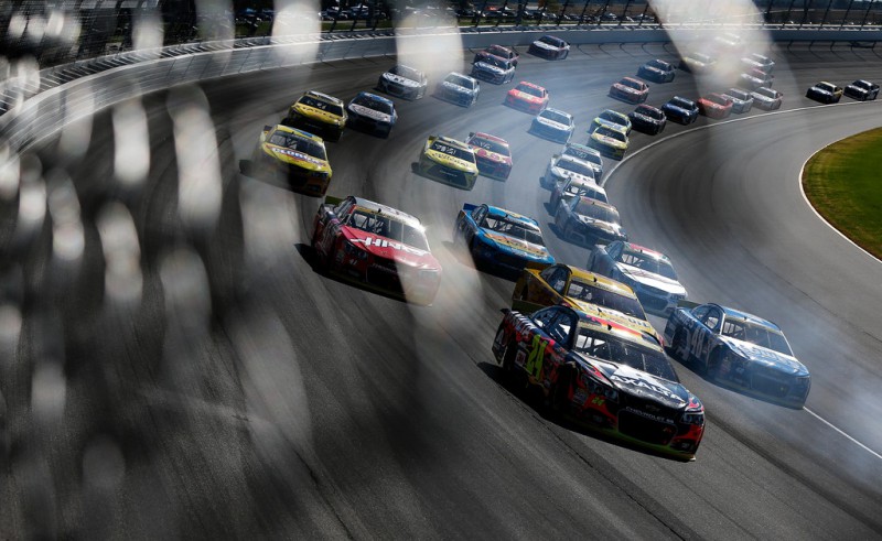 Jeff Gordon, driver of the #24 AXALTA Chevrolet, leads a pack of cars during the NASCAR Sprint Cup Series myAFibRisk.com 400 at Chicagoland Speedway on September 20, 2015 in Joliet, Illinois. Jeff Gordon, driver of the #24 AXALTA Chevrolet, leads a pack of cars during the NASCAR Sprint Cup Series myAFibRisk.com 400 at Chicagoland Speedway on September 20, 2015 in Joliet, Illinois.