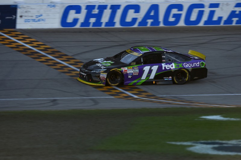 Denny Hamlin, driver of the #11 FedEx Ground Toyota, crosses the finish-line to win the NASCAR Sprint Cup Series myAFibRisk.com 400 at Chicagoland Speedway on September 20, 2015 in Joliet, Illinois. Denny Hamlin, driver of the #11 FedEx Ground Toyota, crosses the finish-line to win the NASCAR Sprint Cup Series myAFibRisk.com 400 at Chicagoland Speedway on September 20, 2015 in Joliet, Illinois.