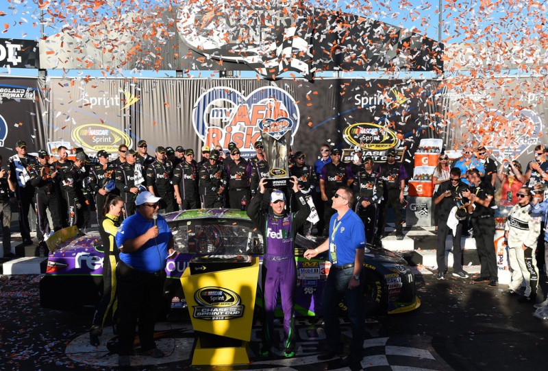 Denny Hamlin, driver of the #11 FedEx Ground Toyota, celebrates in Victory Lane after winning the NASCAR Sprint Cup Series myAFibRisk.com 400 at Chicagoland Speedway on September 20, 2015 in Joliet, Illinois. Denny Hamlin, driver of the #11 FedEx Ground Toyota, celebrates in Victory Lane after winning the NASCAR Sprint Cup Series myAFibRisk.com 400 at Chicagoland Speedway on September 20, 2015 in Joliet, Illinois.