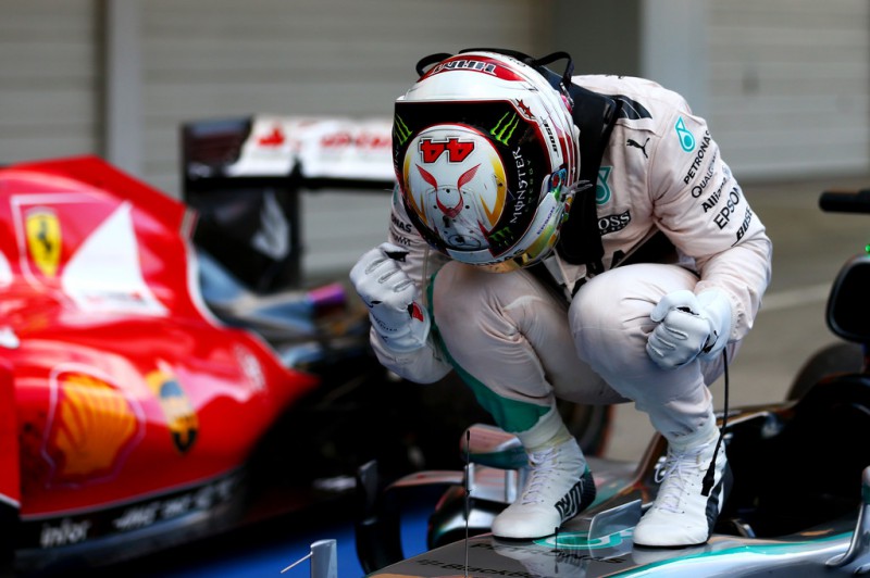 Lewis Hamilton of Great Britain and Mercedes GP celebrates in Parc Ferme after winning the Formula One Grand Prix of Japan at Suzuka Circuit on September 27, 2015 in Suzuka, Japan. Lewis Hamilton of Great Britain and Mercedes GP celebrates in Parc Ferme after winning the Formula One Grand Prix of Japan at Suzuka Circuit on September 27, 2015 in Suzuka, Japan.