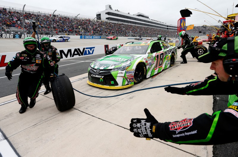 Kyle Busch, driver of the #18 Interstate Batteries Toyota, pits during the NASCAR Sprint Cup Series AAA 400 at Dover International Speedway on October 4, 2015 in Dover, Delaware. Kyle Busch, driver of the #18 Interstate Batteries Toyota, pits during the NASCAR Sprint Cup Series AAA 400 at Dover International Speedway on October 4, 2015 in Dover, Delaware.