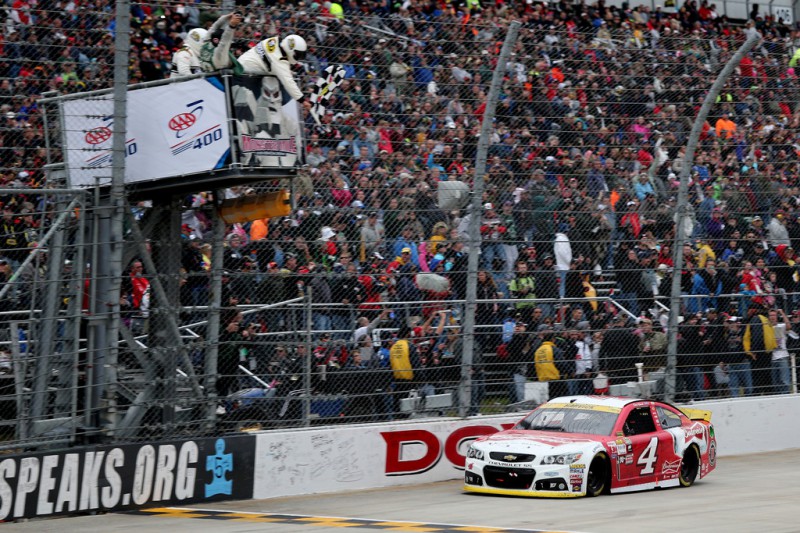Kevin Harvick, driver of the #4 Budweiser/Jimmy John's Chevrolet, takes the checkered flag to win the NASCAR Sprint Cup Series AAA 400 at Dover International Speedway on October 4, 2015 in Dover, Delaware. Kevin Harvick, driver of the #4 Budweiser/Jimmy John's Chevrolet, takes the checkered flag to win the NASCAR Sprint Cup Series AAA 400 at Dover International Speedway on October 4, 2015 in Dover, Delaware.