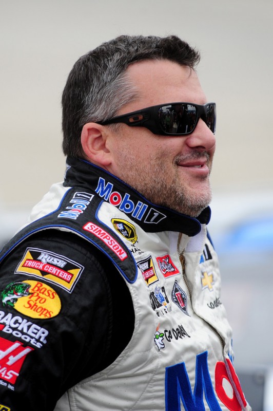 Tony Stewart, driver of the #14 Mobil 1/Bass Pro Shops Chevrolet, stands on the grid before the NASCAR Sprint Cup Series AAA 400 at Dover International Speedway on October 4, 2015 in Dover, Delaware. Tony Stewart, driver of the #14 Mobil 1/Bass Pro Shops Chevrolet, stands on the grid before the NASCAR Sprint Cup Series AAA 400 at Dover International Speedway on October 4, 2015 in Dover, Delaware.