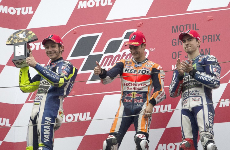 (L-R) Valentino Rossi of Italy and Movistar Yamaha MotoGP, Dani Pedrosa of Spain and Repsol Honda Team and Jorge Lorenzo of Spain and Movistar Yamaha MotoGP celebrate on the podium at the end of the MotoGP race during the MotoGP Of Japan - Race at Twin Ring Motegi on October 11, 2015 in Motegi, Japan. (L-R) Valentino Rossi of Italy and Movistar Yamaha MotoGP, Dani Pedrosa of Spain and Repsol Honda Team and Jorge Lorenzo of Spain and Movistar Yamaha MotoGP celebrate on the podium at the end of the MotoGP race during the MotoGP Of Japan - Race at Twin Ring Motegi on October 11, 2015 in Motegi, Japan.