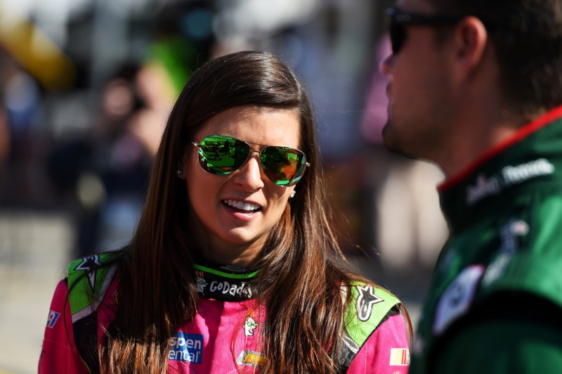 Danica Patrick, driver of the #10 GoDaddy Chevrolet, talks to Ricky Stenhouse Jr., driver of the #17 Juicy Juice Ford, on the grid prior to the NASCAR Sprint Cup Series Bank of America 500 at Charlotte Motor Speedway on October 11, 2015 in Charlotte, North Carolina. Danica Patrick, driver of the #10 GoDaddy Chevrolet, talks to Ricky Stenhouse Jr., driver of the #17 Juicy Juice Ford, on the grid prior to the NASCAR Sprint Cup Series Bank of America 500 at Charlotte Motor Speedway on October 11, 2015 in Charlotte, North Carolina.
