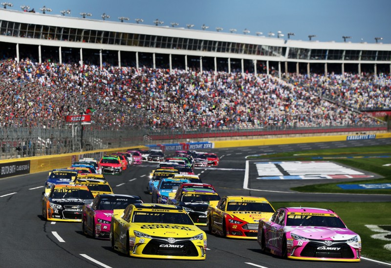 Matt Kenseth, driver of the #20 Dollar General Toyota, and Kyle Busch, driver of the #18 M&M's Pretty In Pink Foundation Toyota, lead the field on the first lap of the NASCAR Sprint Cup Series Bank of America 500 at Charlotte Motor Speedway on October 11, 2015 in Charlotte, North Carolina. Matt Kenseth, driver of the #20 Dollar General Toyota, and Kyle Busch, driver of the #18 M&M's Pretty In Pink Foundation Toyota, lead the field on the first lap of the NASCAR Sprint Cup Series Bank of America 500 at Charlotte Motor Speedway on October 11, 2015 in Charlotte, North Carolina.