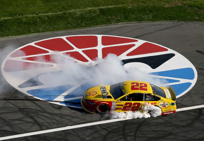 Joey Logano, driver of the #22 Shell Pennzoil Ford, celebrates with a burnout after winning the NASCAR Sprint Cup Series Bank of America 500 at Charlotte Motor Speedway on October 11, 2015 in Charlotte, North Carolina. Joey Logano, driver of the #22 Shell Pennzoil Ford, celebrates with a burnout after winning the NASCAR Sprint Cup Series Bank of America 500 at Charlotte Motor Speedway on October 11, 2015 in Charlotte, North Carolina.