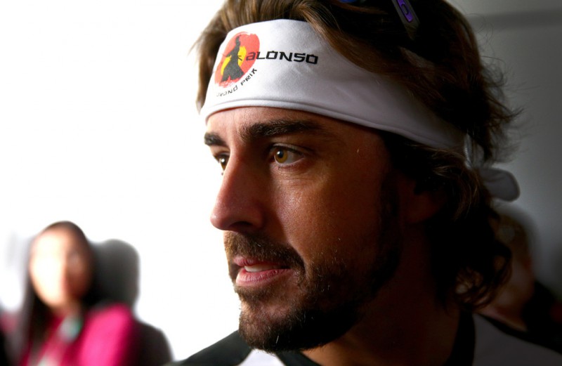Fernando Alonso of Spain and McLaren Honda looks on before the drivers' parade before the Formula One Grand Prix of Russia at Sochi Autodrom on October 11, 2015 in Sochi, Russia. Fernando Alonso of Spain and McLaren Honda looks on before the drivers' parade before the Formula One Grand Prix of Russia at Sochi Autodrom on October 11, 2015 in Sochi, Russia.