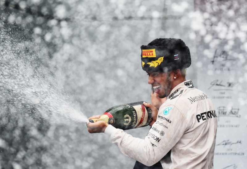 Lewis Hamilton of Great Britain and Mercedes GP celebrates after winning the Formula One Grand Prix of Russia at Sochi Autodrom on October 11, 2015 in Sochi, Russia. Lewis Hamilton of Great Britain and Mercedes GP celebrates after winning the Formula One Grand Prix of Russia at Sochi Autodrom on October 11, 2015 in Sochi, Russia.