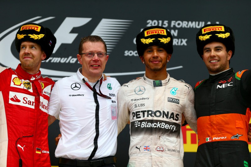 Lewis Hamilton of Great Britain and Mercedes GP celebrates on the podium next to Sebastian Vettel of Germany and Ferrari and Sergio Perez of Mexico and Force India after winning the Formula One Grand Prix of Russia at Sochi Autodrom on October 11, 2015 in Sochi, Russia. Lewis Hamilton of Great Britain and Mercedes GP celebrates on the podium next to Sebastian Vettel of Germany and Ferrari and Sergio Perez of Mexico and Force India after winning the Formula One Grand Prix of Russia at Sochi Autodrom on October 11, 2015 in Sochi, Russia.