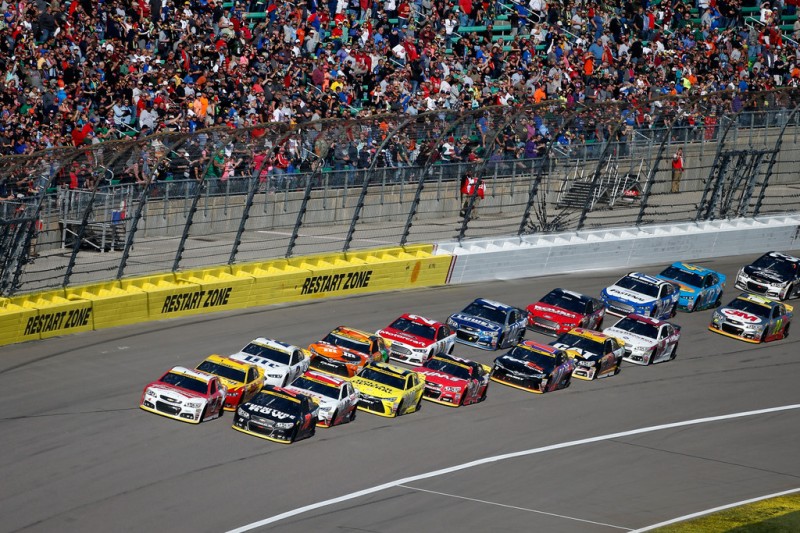 Kevin Harvick, driver of the #4 Budweiser/Jimmy John's Chevrolet, and Martin Truex Jr., driver of the #78 Furniture Row/Visser Precision Chevrolet, lead the field in a restart during the NASCAR Sprint Cup Series Hollywood Casino 400 at Kansas Speedway on October 18, 2015 in Kansas City, Kansas. Kevin Harvick, driver of the #4 Budweiser/Jimmy John's Chevrolet, and Martin Truex Jr., driver of the #78 Furniture Row/Visser Precision Chevrolet, lead the field in a restart during the NASCAR Sprint Cup Series Hollywood Casino 400 at Kansas Speedway on October 18, 2015 in Kansas City, Kansas.