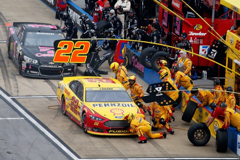 Joey Logano, driver of the #22 Shell Pennzoil Ford, and Jamie McMurray, driver of the #1 Cessna Pink Chevrolet, pit during the NASCAR Sprint Cup Series CampingWorld.com 500 at Talladega Superspeedway on October 25, 2015 in Talladega, Alabama. Joey Logano, driver of the #22 Shell Pennzoil Ford, and Jamie McMurray, driver of the #1 Cessna Pink Chevrolet, pit during the NASCAR Sprint Cup Series CampingWorld.com 500 at Talladega Superspeedway on October 25, 2015 in Talladega, Alabama.