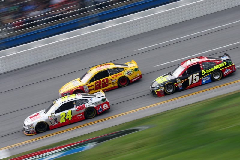 Jeff Gordon, driver of the #24 3M Chevrolet, and Joey Logano, driver of the #22 Shell Pennzoil Ford, lead Clint Bowyer, driver of the #15 5-hour Energy Toyota, during the NASCAR Sprint Cup Series CampingWorld.com 500 at Talladega Superspeedway on October 25, 2015 in Talladega, Alabama. Jeff Gordon, driver of the #24 3M Chevrolet, and Joey Logano, driver of the #22 Shell Pennzoil Ford, lead Clint Bowyer, driver of the #15 5-hour Energy Toyota, during the NASCAR Sprint Cup Series CampingWorld.com 500 at Talladega Superspeedway on October 25, 2015 in Talladega, Alabama.