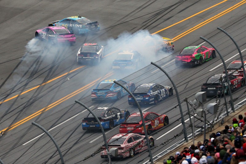 Cars wreck on the final restart during the NASCAR Sprint Cup Series CampingWorld.com 500 at Talladega Superspeedway on October 25, 2015 in Talladega, Alabama. Cars wreck on the final restart during the NASCAR Sprint Cup Series CampingWorld.com 500 at Talladega Superspeedway on October 25, 2015 in Talladega, Alabama.