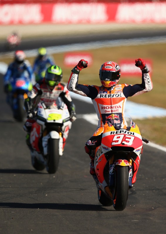 Marc Marquez of Spain and Repsol Honda Team celebrates as he returns to pit lane after winning the 2015 MotoGP of Australia at Phillip Island Grand Prix Circuit on October 18, 2015 in Phillip Island, Australia. Marc Marquez of Spain and Repsol Honda Team celebrates as he returns to pit lane after winning the 2015 MotoGP of Australia at Phillip Island Grand Prix Circuit on October 18, 2015 in Phillip Island, Australia.