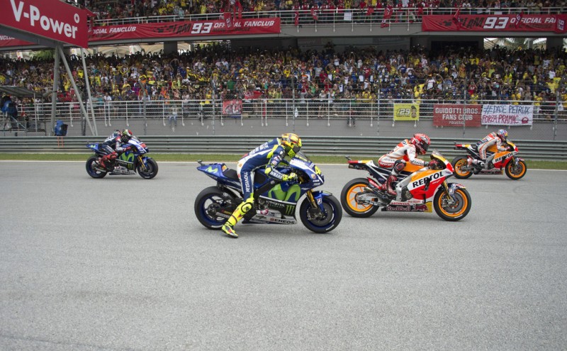 The MotoGP riders start from the grid during the MotoGP race during the MotoGP Of Malaysia at Sepang Circuit on October 25, 2015 in Kuala Lumpur, Malaysia. The MotoGP riders start from the grid during the MotoGP race during the MotoGP Of Malaysia at Sepang Circuit on October 25, 2015 in Kuala Lumpur, Malaysia.
