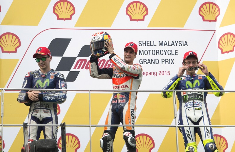 (L-R) Jorge Lorenzo of Spain and Movistar Yamaha MotoGP, Dani Pedrosa of Spain and Repsol Honda Team and Valentino Rossi of Italy and Movistar Yamaha MotoGP celebrate on the podium at the end of the MotoGP race during the MotoGP Of Malaysia - Race at Sepang Circuit on October 25, 2015 in Kuala Lumpur, Malaysia. (L-R) Jorge Lorenzo of Spain and Movistar Yamaha MotoGP, Dani Pedrosa of Spain and Repsol Honda Team and Valentino Rossi of Italy and Movistar Yamaha MotoGP celebrate on the podium at the end of the MotoGP race during the MotoGP Of Malaysia - Race at Sepang Circuit on October 25, 2015 in Kuala Lumpur, Malaysia.