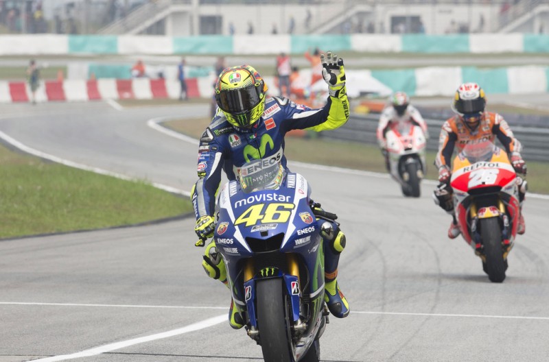 Valentino Rossi of Italy and Movistar Yamaha MotoGP celebrates third place at the end of the MotoGP race during the MotoGP Of Malaysia at Sepang Circuit on October 25, 2015 in Kuala Lumpur, Malaysia. Valentino Rossi of Italy and Movistar Yamaha MotoGP celebrates third place at the end of the MotoGP race during the MotoGP Of Malaysia at Sepang Circuit on October 25, 2015 in Kuala Lumpur, Malaysia.