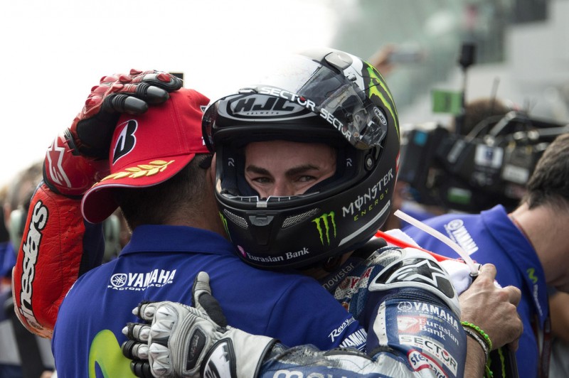 Jorge Lorenzo of Spain and Movistar Yamaha MotoGP celebrates second place with mechanic at the end of the MotoGP race during the MotoGP Of Malaysia at Sepang Circuit on October 25, 2015 in Kuala Lumpur, Malaysia. Jorge Lorenzo of Spain and Movistar Yamaha MotoGP celebrates second place with mechanic at the end of the MotoGP race during the MotoGP Of Malaysia at Sepang Circuit on October 25, 2015 in Kuala Lumpur, Malaysia.