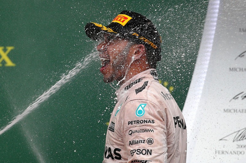 Lewis Hamilton of Great Britain and Mercedes GP celebrates on the podium after winning the United States Formula One Grand Prix and the championship at Circuit of The Americas on October 25, 2015 in Austin, United States. Lewis Hamilton of Great Britain and Mercedes GP celebrates on the podium after winning the United States Formula One Grand Prix and the championship at Circuit of The Americas on October 25, 2015 in Austin, United States.