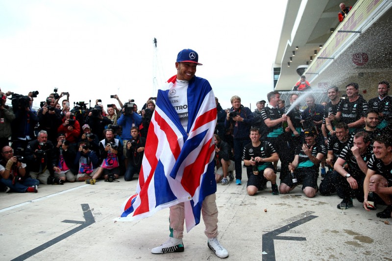 Lewis Hamilton of Great Britain and Mercedes GP celebrates with the team in the pit lane after winning the United States Formula One Grand Prix and the championship at Circuit of The Americas on October 25, 2015 in Austin, United States. Lewis Hamilton of Great Britain and Mercedes GP celebrates with the team in the pit lane after winning the United States Formula One Grand Prix and the championship at Circuit of The Americas on October 25, 2015 in Austin, United States.
