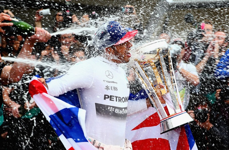 Lewis Hamilton of Great Britain and Mercedes GP celebrates with the team in the pit lane after winning the United States Formula One Grand Prix and the championship at Circuit of The Americas on October 25, 2015 in Austin, United States. Lewis Hamilton of Great Britain and Mercedes GP celebrates with the team in the pit lane after winning the United States Formula One Grand Prix and the championship at Circuit of The Americas on October 25, 2015 in Austin, United States.