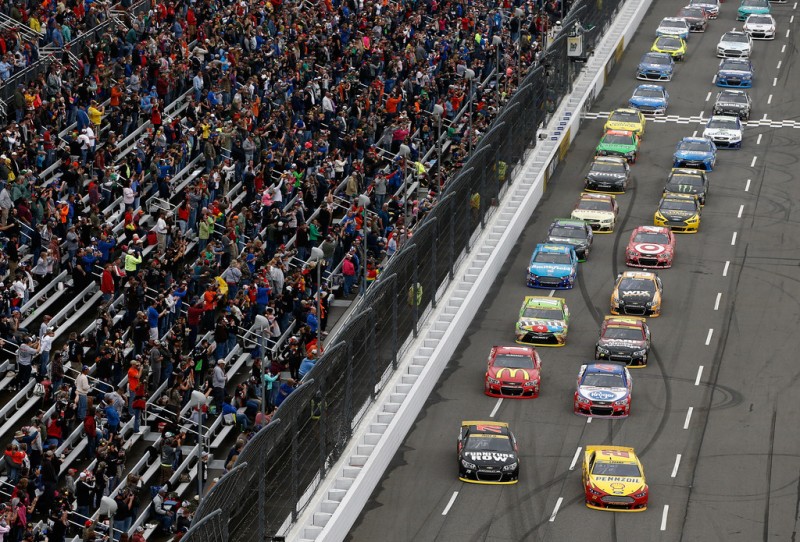 Joey Logano, driver of the #22 Shell Pennzoil Ford, and Martin Truex Jr., driver of the #78 Furniture Row/Visser Precision Chevrolet, lead the field into turn one to officially start the NASCAR Sprint Cup Series Goody's Headache Relief Shot 500 on lap seven at Martinsville Speedway on November 1, 2015 in Martinsville, Virginia. Joey Logano, driver of the #22 Shell Pennzoil Ford, and Martin Truex Jr., driver of the #78 Furniture Row/Visser Precision Chevrolet, lead the field into turn one to officially start the NASCAR Sprint Cup Series Goody's Headache Relief Shot 500 on lap seven at Martinsville Speedway on November 1, 2015 in Martinsville, Virginia.