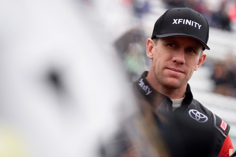 Carl Edwards, driver of the #19 XFINITY Toyota, stands on the grid during the NASCAR Sprint Cup Series Goody's Headache Relief Shot 500 at Martinsville Speedway on November 1, 2015 in Martinsville, Virginia. Carl Edwards, driver of the #19 XFINITY Toyota, stands on the grid during the NASCAR Sprint Cup Series Goody's Headache Relief Shot 500 at Martinsville Speedway on November 1, 2015 in Martinsville, Virginia.