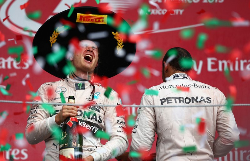 Nico Rosberg of Germany and Mercedes GP celebrates on the podium next to Lewis Hamilton of Great Britain and Mercedes GP after winning the Formula One Grand Prix of Mexico at Autodromo Hermanos Rodriguez on November 1, 2015 in Mexico City, Mexico. Nico Rosberg of Germany and Mercedes GP celebrates on the podium next to Lewis Hamilton of Great Britain and Mercedes GP after winning the Formula One Grand Prix of Mexico at Autodromo Hermanos Rodriguez on November 1, 2015 in Mexico City, Mexico.