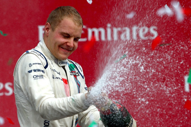 Valtteri Bottas of Finland and Williams celebrates on the podium after finishing third in the Formula One Grand Prix of Mexico at Autodromo Hermanos Rodriguez on November 1, 2015 in Mexico City, Mexico. Valtteri Bottas of Finland and Williams celebrates on the podium after finishing third in the Formula One Grand Prix of Mexico at Autodromo Hermanos Rodriguez on November 1, 2015 in Mexico City, Mexico.