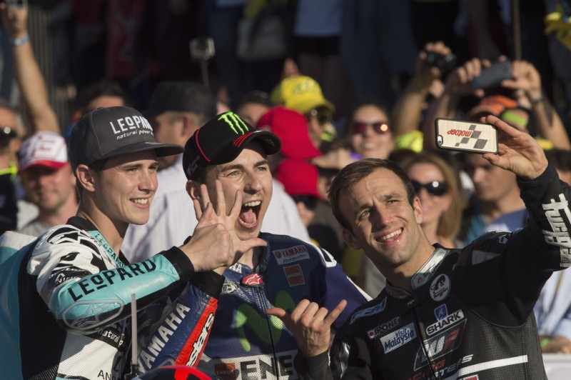 (L-R) Danny Kent of Britain and Leopard Racing, Jorge Lorenzo of Spain and Movistar Yamaha MotoGP and Johann Zarco of Frence and AJO Motorsport pose for a selfie to celebrate the three Champions of the 2015 season during the MotoGP Race at Ricardo Tormo Circuit on November 8, 2015 in Valencia, Spain. (L-R) Danny Kent of Britain and Leopard Racing, Jorge Lorenzo of Spain and Movistar Yamaha MotoGP and Johann Zarco of Frence and AJO Motorsport pose for a selfie to celebrate the three Champions of the 2015 season during the MotoGP Race at Ricardo Tormo Circuit on November 8, 2015 in Valencia, Spain.
