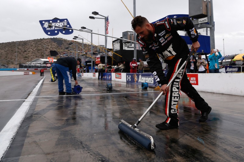 Crew members for Ryan Newman, driver of the #31 Caterpillar Global Mining Chevrolet, dry their pit box prior to the NASCAR Sprint Cup Series Quicken Loans Race for Heroes 500 at Phoenix International Raceway on November 15, 2015 in Avondale, Arizona. Crew members for Ryan Newman, driver of the #31 Caterpillar Global Mining Chevrolet, dry their pit box prior to the NASCAR Sprint Cup Series Quicken Loans Race for Heroes 500 at Phoenix International Raceway on November 15, 2015 in Avondale, Arizona.