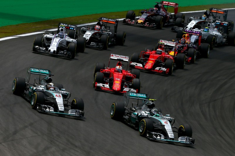 Nico Rosberg of Germany and Mercedes GP and Lewis Hamilton of Great Britain and Mercedes GP race into the first corner followed by the rest of the field during the Formula One Grand Prix of Brazil at Autodromo Jose Carlos Pace on November 15, 2015 in Sao Paulo, Brazil. Nico Rosberg of Germany and Mercedes GP and Lewis Hamilton of Great Britain and Mercedes GP race into the first corner followed by the rest of the field during the Formula One Grand Prix of Brazil at Autodromo Jose Carlos Pace on November 15, 2015 in Sao Paulo, Brazil.