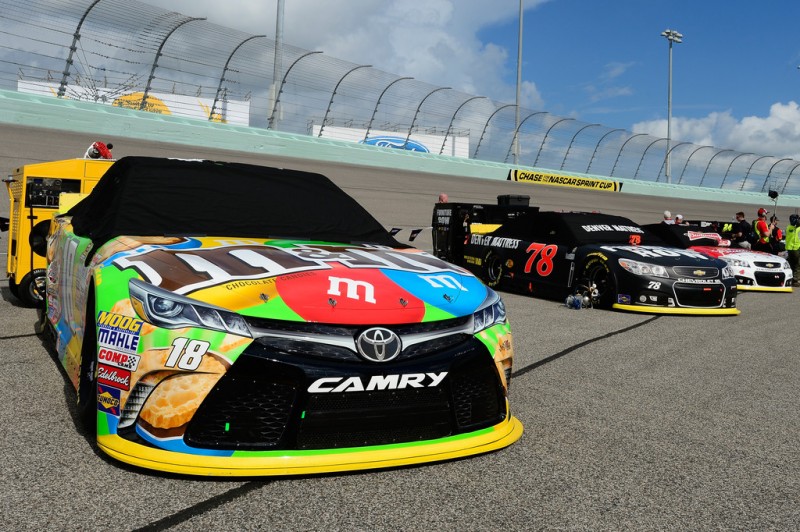 The cars of Kyle Busch, driver of the #18 M&M's Crispy Toyota, Martin Truex Jr., driver of the #78 Furniture Row/Denver Mattress Chevrolet, and Kevin Harvick, driver of the #4 Budweiser/Jimmy John's Chevrolet, are lined up on pit road prior to the NASCAR Sprint Cup Series Ford EcoBoost 400 at Homestead-Miami Speedway on November 22, 2015 in Homestead, Florida. The cars of Kyle Busch, driver of the #18 M&M's Crispy Toyota, Martin Truex Jr., driver of the #78 Furniture Row/Denver Mattress Chevrolet, and Kevin Harvick, driver of the #4 Budweiser/Jimmy John's Chevrolet, are lined up on pit road prior to the NASCAR Sprint Cup Series Ford EcoBoost 400 at Homestead-Miami Speedway on November 22, 2015 in Homestead, Florida.