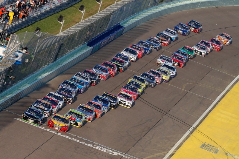 Denny Hamlin, driver of the #11 FedEx Ground Toyota, and Joey Logano, driver of the #22 Shell Pennzoil Ford, leads the field past the green flag to start the NASCAR Sprint Cup Series Ford EcoBoost 400 at Homestead-Miami Speedway on November 22, 2015 in Homestead, Florida. Denny Hamlin, driver of the #11 FedEx Ground Toyota, and Joey Logano, driver of the #22 Shell Pennzoil Ford, leads the field past the green flag to start the NASCAR Sprint Cup Series Ford EcoBoost 400 at Homestead-Miami Speedway on November 22, 2015 in Homestead, Florida.