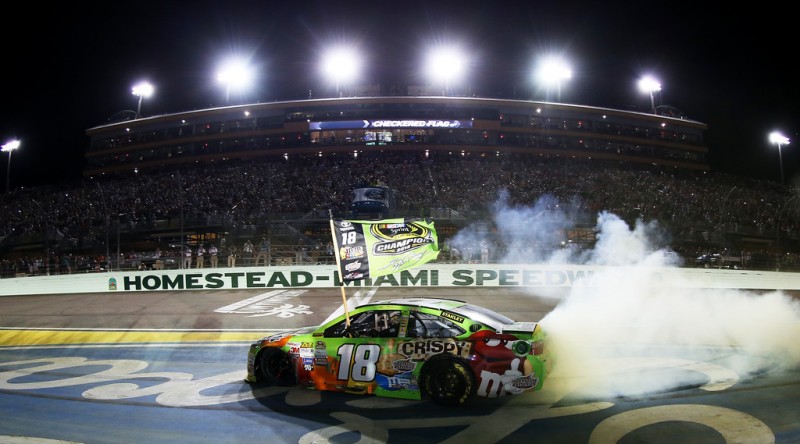 Kyle Busch, driver of the #18 M&M's Crispy Toyota, celebrates winning the series championship and the race with a burnout after the NASCAR Sprint Cup Series Ford EcoBoost 400 at Homestead-Miami Speedway on November 22, 2015 in Homestead, Florida. Kyle Busch, driver of the #18 M&M's Crispy Toyota, celebrates winning the series championship and the race with a burnout after the NASCAR Sprint Cup Series Ford EcoBoost 400 at Homestead-Miami Speedway on November 22, 2015 in Homestead, Florida.