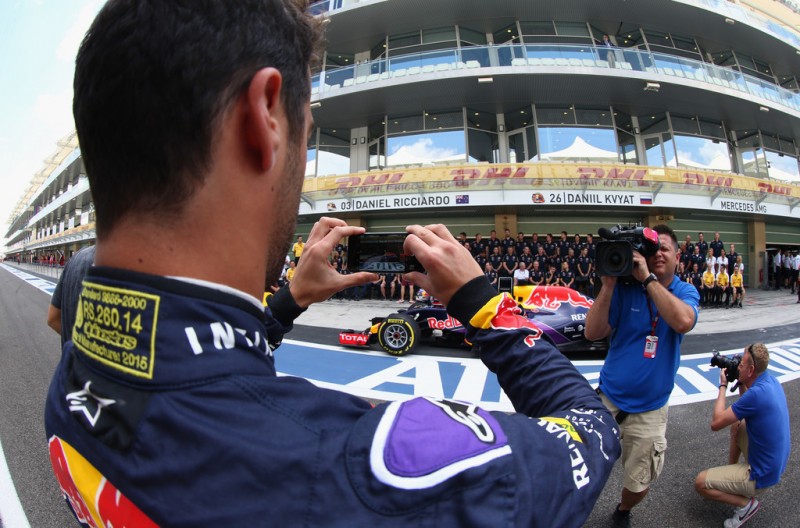 Daniel Ricciardo of Australia and Infiniti Red Bull Racing takes a photograph on his phone before the team photograph in the pit lane before the Abu Dhabi Formula One Grand Prix at Yas Marina Circuit on November 29, 2015 in Abu Dhabi, United Arab Emirates. Daniel Ricciardo of Australia and Infiniti Red Bull Racing takes a photograph on his phone before the team photograph in the pit lane before the Abu Dhabi Formula One Grand Prix at Yas Marina Circuit on November 29, 2015 in Abu Dhabi, United Arab Emirates.
