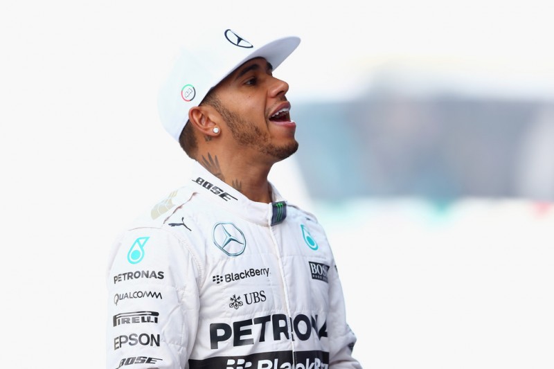 Lewis Hamilton of Great Britain and Mercedes GP takes part in the team photograph in the pit lane before the Abu Dhabi Formula One Grand Prix at Yas Marina Circuit on November 29, 2015 in Abu Dhabi, United Arab Emirates. Lewis Hamilton of Great Britain and Mercedes GP takes part in the team photograph in the pit lane before the Abu Dhabi Formula One Grand Prix at Yas Marina Circuit on November 29, 2015 in Abu Dhabi, United Arab Emirates.