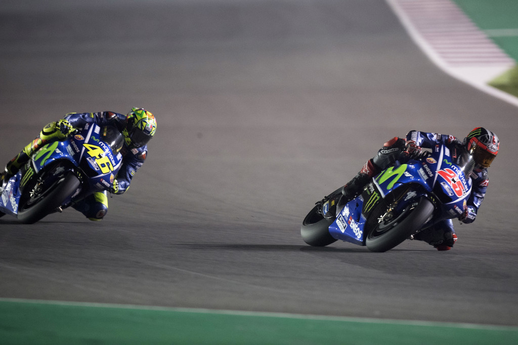 Movistar Yamaha MotoGP's Spanish rider Maverick Vinales (front) competes during the 2017 Qatar MotoGP at the Losail International Circuit, north of the capital Doha on March 26, 2017..Spain's Maverick Vinales of Movistar Yamaha MotoGP won the season-opening Qatar MotoGP on March 26, 2017, shrugging off a poor start from pole position under the desert floodlights. Defending world champion Marc Marquez was fourth on a Honda. Movistar Yamaha MotoGP's Spanish rider Maverick Vinales (front) competes during the 2017 Qatar MotoGP at the Losail International Circuit, north of the capital Doha on March 26, 2017..Spain's Maverick Vinales of Movistar Yamaha MotoGP won the season-opening Qatar MotoGP on March 26, 2017, shrugging off a poor start from pole position under the desert floodlights. Defending world champion Marc Marquez was fourth on a Honda.