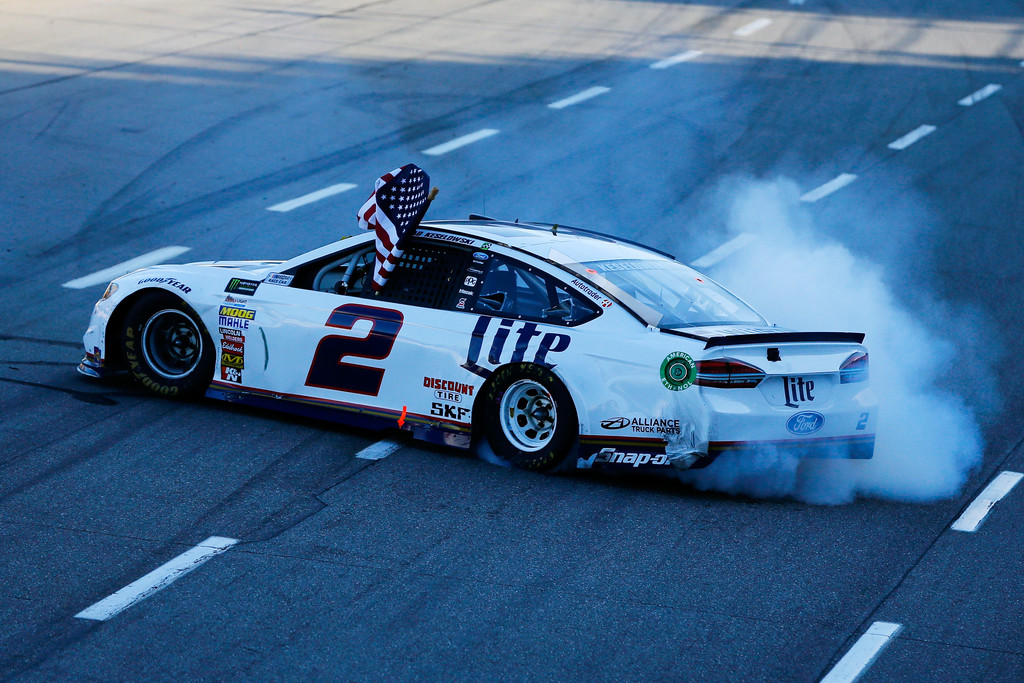 Brad Keselowski, driver of the #2 Miller Lite Ford, celebrates after winning the Monster Energy NASCAR Cup Series STP 500 at Martinsville Speedway on April 2, 2017 in Martinsville, Virginia. Brad Keselowski, driver of the #2 Miller Lite Ford, celebrates after winning the Monster Energy NASCAR Cup Series STP 500 at Martinsville Speedway on April 2, 2017 in Martinsville, Virginia.