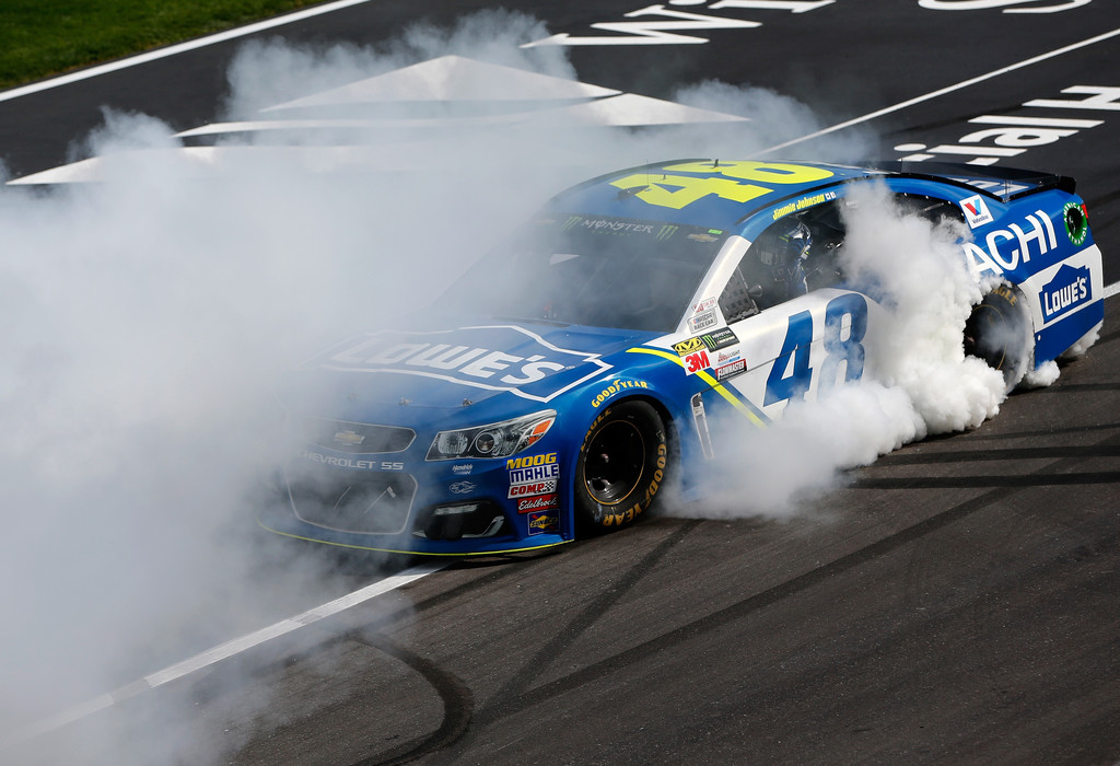 Jimmie Johnson, driver of the #48 Lowe's Chevrolet, celebrates with a burn out after winning the Monster Energy NASCAR Cup Series O'Reilly Auto Parts 500 at Texas Motor Speedway on April 9, 2017 in Fort Worth, Texas. Jimmie Johnson, driver of the #48 Lowe's Chevrolet, celebrates with a burn out after winning the Monster Energy NASCAR Cup Series O'Reilly Auto Parts 500 at Texas Motor Speedway on April 9, 2017 in Fort Worth, Texas.