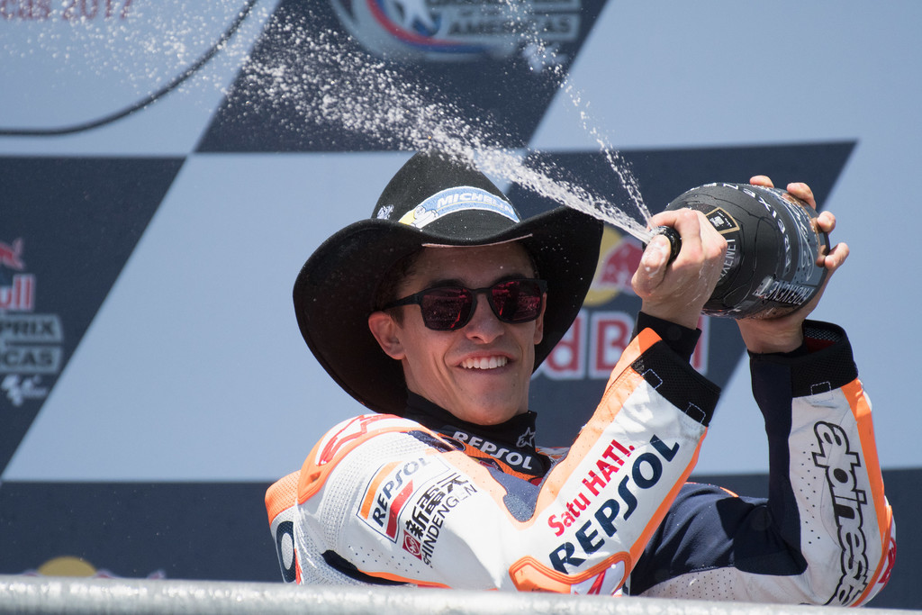 Marc Marquez of Spain and Repsol Honda Team celebrates the victory on the podium at the end of the MotoGP race during the MotoGp Red Bull U.S. Grand Prix of The Americas - Race at Circuit of The Americas on April 23, 2017 in Austin, Texas. Marc Marquez of Spain and Repsol Honda Team celebrates the victory on the podium at the end of the MotoGP race during the MotoGp Red Bull U.S. Grand Prix of The Americas - Race at Circuit of The Americas on April 23, 2017 in Austin, Texas.